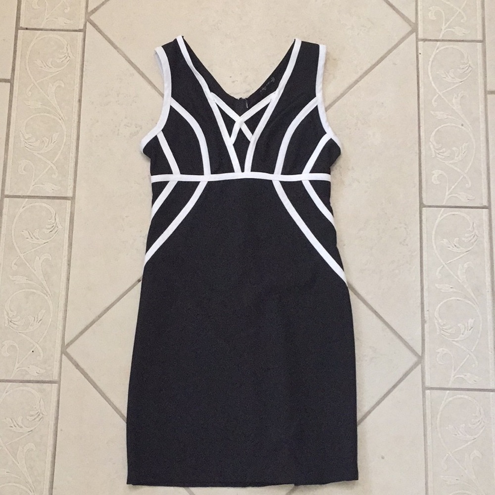 Black dress with white piping and deep mesh front